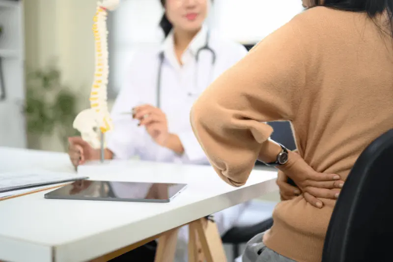 Woman Suffering with Degenerative Disc Disease in South Florida