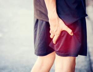 man holding leg