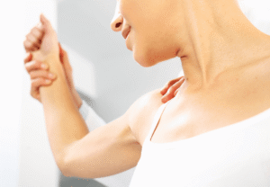 woman getting therapy on her arm
